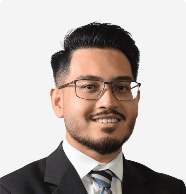 Executive leader of ENIXEN Group smiling in professional attire.